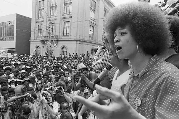 Radical political activist Angela Davis speaks at a street rally in Raleigh, North Carolina, 4th July 1974.