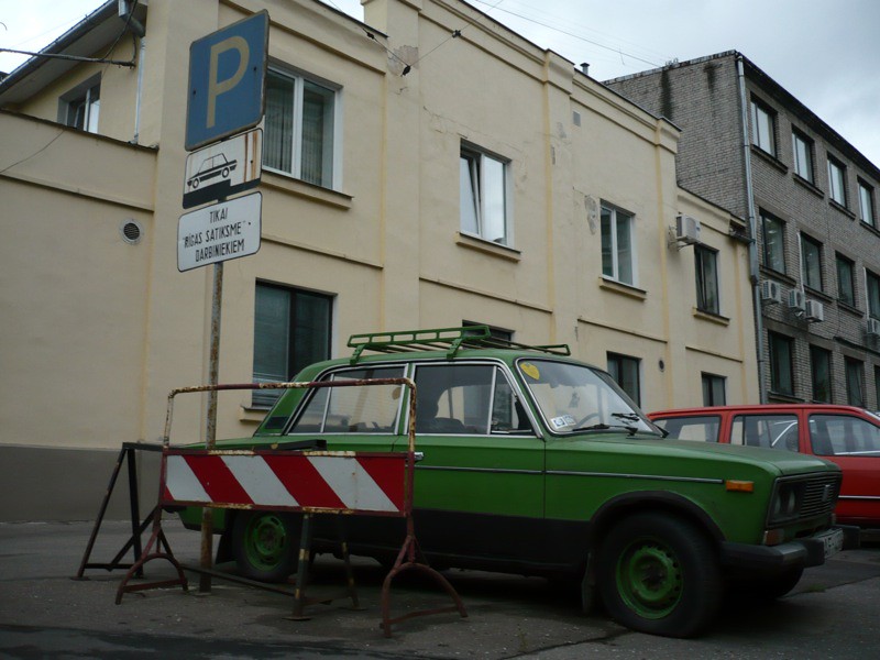 Green car in grey land